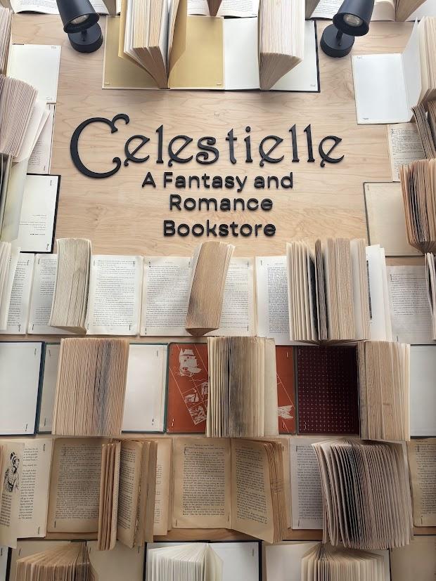 The Celestielle book wall, with the logo set among fanned-open books